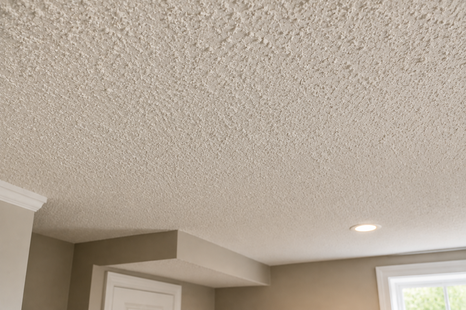 Close-up of a popcorn textured ceiling before removal